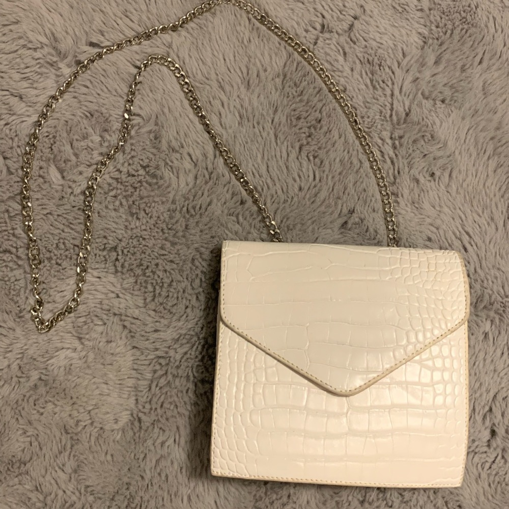 White snakeskin purse with silver strap